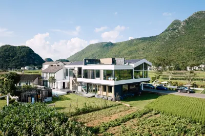 Xingyi Wanfeng Linyi Boutique Inn (Wanfenglin Baguatian Attractions) Отели в г. Синъи