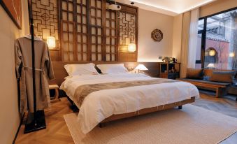 Taohua Island Jianghu Hot Spring Homestay Hotel (Xinzhou Ancient City Branch)