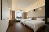 Ma'anshan Licheng Ruixuan Hotel (Cuilin Shuicheng Huafei Road) - พร้อมอาหารเช้า