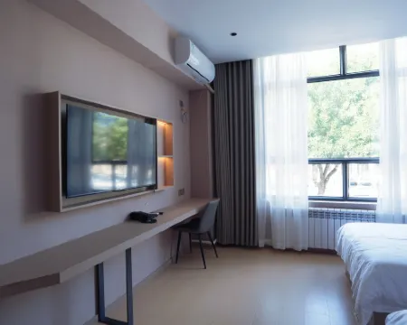 Xibuchun Hotel Hotele w: Tacheng