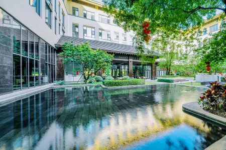 Artel Hotel Отели в г. Синьсин