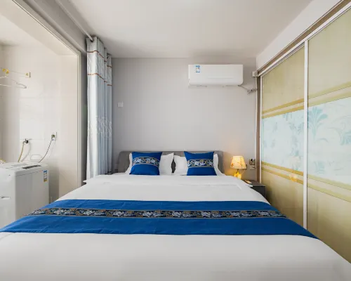 Qingyun Boutique Vacation Apartment (Weihai High-Speed Railway Station Hanlefang) Zimmer Photos