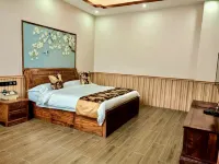 Mengla Yiwu Grand Hotel