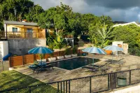 Auguste's Creole Houses in a Tropical Garden