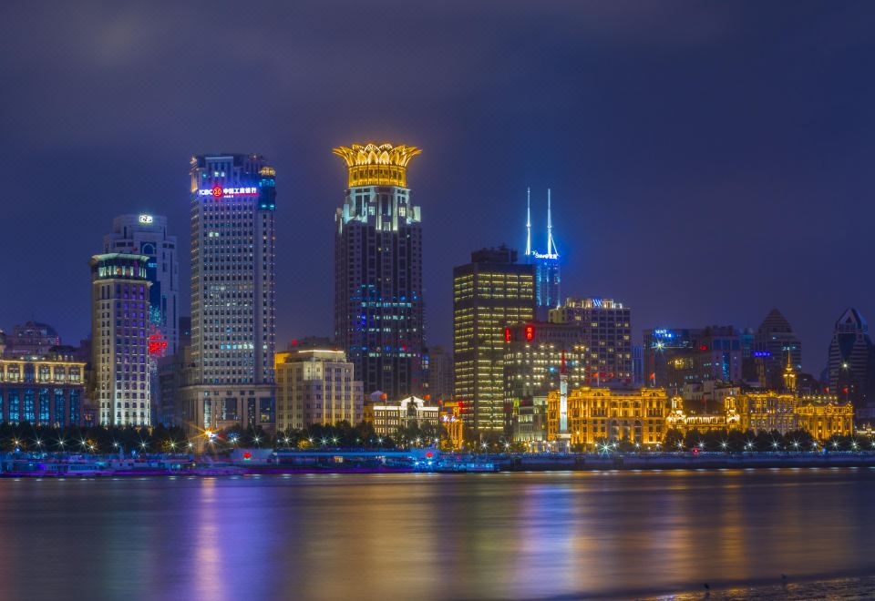 A city's illuminated skyline at night, with buildings on both sides at The Westin Bund Center Shanghai
