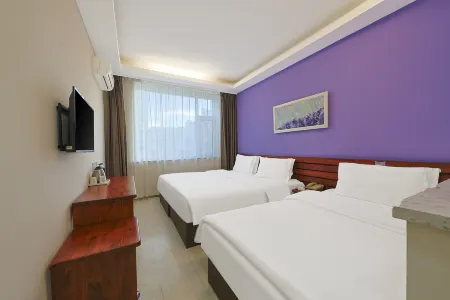 Xunyicao Fashion Hotel Отели рядом с достопримечательностью «Baicheng Library»