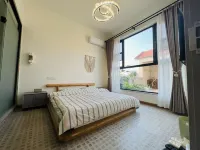 Kaifeng Qieman Homestay (Kaifeng Qingming Riverside Garden) Hotels in Kaifeng station area