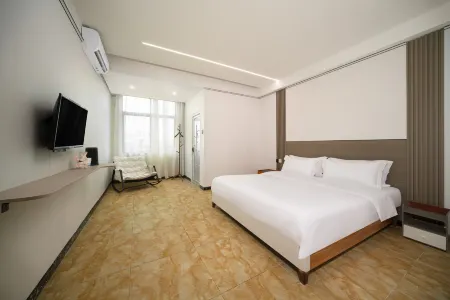 Haikou(yuepanju)Hotei(MeilanAiport) Отели рядом с достопримечательностью «Hainan Normal University (Guilinyang Campus)»