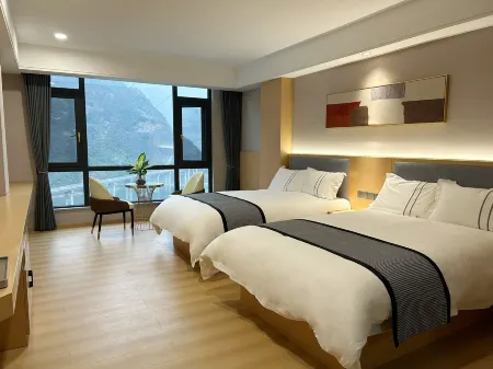 Xinbo Grand Hotel Отели в г. Юншань