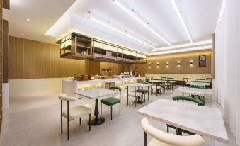 Magnolia Business Hotel ( Dalian Jinzhou Hengda Garden)