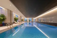 Jiamusi Jinli Apartment - ที่มีสระว่ายน้ำ