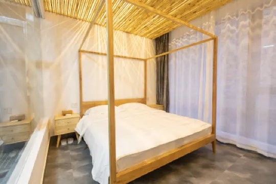 Xuantong Homestay Отели рядом с достопримечательностью «Tianlongjiupu»