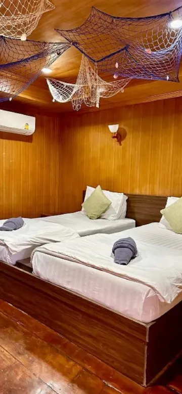 ห้องพักสำหรับสามท่านพร้อมวิวสวน