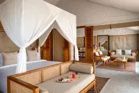 The Outpost Al Barari Camp Hotels near Mesaieed beach with sand dunes