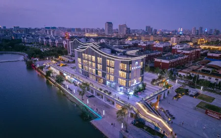 Liaocheng Log House Homestay (Dongchang Lake Branch) Отели рядом с достопримечательностью «Liaocheng Gymnasium»