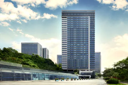 QING SHI · HOTLE Отели рядом с достопримечательностью «Ximing Happy World Huaxia Shijia City Paradise»