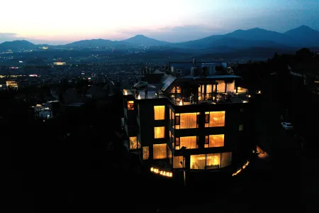 Tengchong Puju Hot Spring Hotel Отели в г. Тенчун