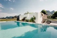 Xingyi Wanfeng Linyi Boutique Inn (Wanfenglin Baguatian Attractions) - ที่มีสระว่ายน้ำ