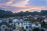 Ruomengyunyuan B&B (Libo Xiaoqikong Scenic Area East Gate) - ที่มีอ่างอาบน้ำ