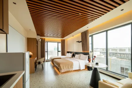 Huajian HOUSE Smart Homestay (Wenjiang University Town Wansheng) Отели рядом с достопримечательностью «Sichuan Jiaotong Zhiye Jishu College»