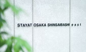 A sign on the side wall indicates that there is no water in the main street of this city at Stayat Osaka Shinsaibashi East