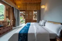 Xingyi Qiangu Jiuye Bed and Breakfast (Fenglin Buyi Scenic Area Branch)