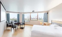 Baiyue Business Hotel (Xin Municipal Hospital)