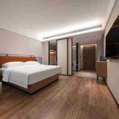 Phoenix Holiday Hotel (Xuefeng Plaza Branch), Dongkou County Rooms