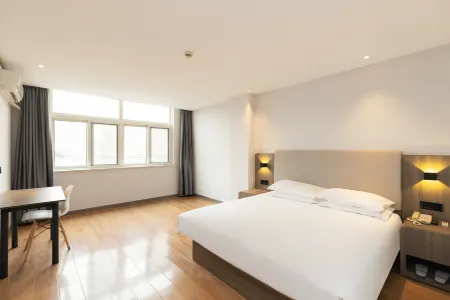 Shell Hotel (Xuzhou Xinyi Nanjing Road Railway Station) Отели в г. Синьи