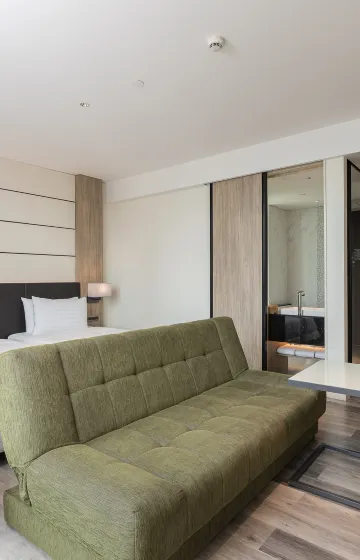 ห้องดีลักซ์หัวมุมสองเตียงเดี่ยวหนึ่งเตียงเสริม