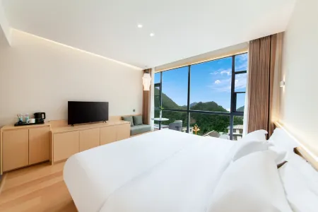 Huanpeng  Homestay Hotel Отели рядом с достопримечательностью «Seven-color Sea»