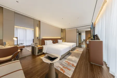 Heyi International Hotel (Jinmei Times Square County Government) Отели в г. Вэнъань