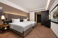 Manon Hotel Yining Border Economic Cooperation Zone Отели в г. Иньинг
