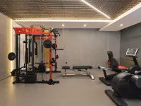 Chonpines Hotel (Daqing West Railway Station Wanda Plaza Branch) - Gym