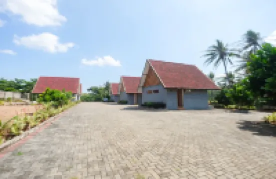 Sinergi的海邊沙央赫烏朗 巴馬布酒店