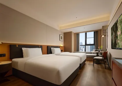 Southwest Business Hotel (Luzhou High speed Railway Station Southwest Business City Branch) - พร้อมWifi