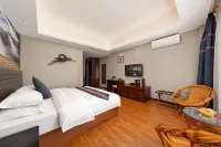 Mijng Qiyuan Minority Theme Hotel - balcon
