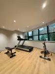 Qian Na Mei Su Hotel (Xiangcheng Wanda Plaza Oubaisa Mall Branch) - Gym
