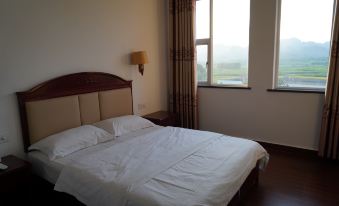 Longxin Business Hotel (Ningming Railway Station)