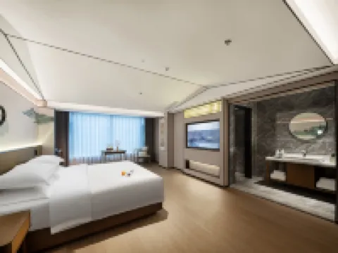 Mo Shang Qing Ju Hotel (Quliang Garment Industrial Park, South University Road, Zhengzhou) Hotel a Xinmi