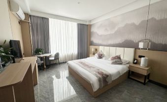 Mangkang Rumei Yijiang Kaiyue Hotel