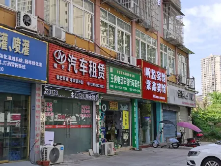 An yue juxin building business hotel Отели рядом с достопримечательностью «Anyue Stone Carvings»