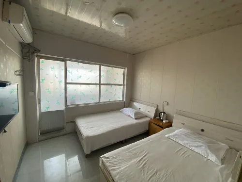 Xinggang Hotel - Homestays
