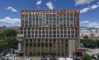 In front of a large building with numerous windows on the side, there is an office block at DCC Hotel (Guangzhou Tianhe Coach Terminal Station)