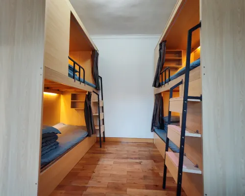 Lijiang Qishangju Youth Hostel الغرف Photos
