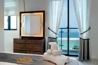 Aina Residency Beachfront Hotel