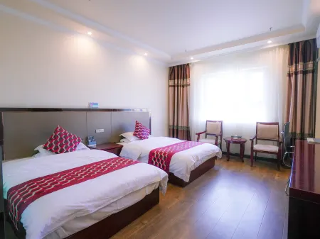 Baiwanjia Business Hotel Отели в г. Куча