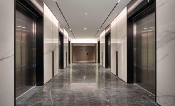 The ground floor of an empty building or office features a long hallway adorned with doors and windows at Yutai Hotel Apartment (Dongmen Pedestrian Street Luohu Port Branch)