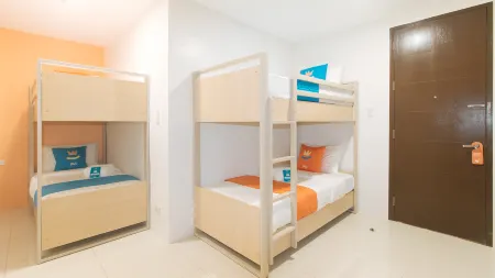 Sans Hotel at One JD Place Makati by RedDoorz