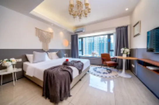 May Boutique Hotel (Xinyang East Railway Station Evergrande Plaza)
